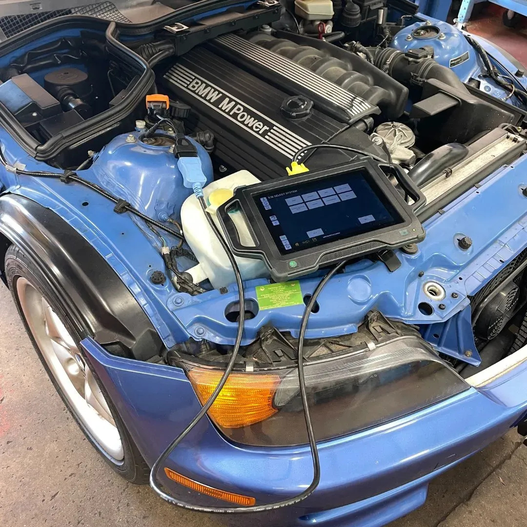 Advanced diagnostic tools for BMW engine analysis in a garage setting